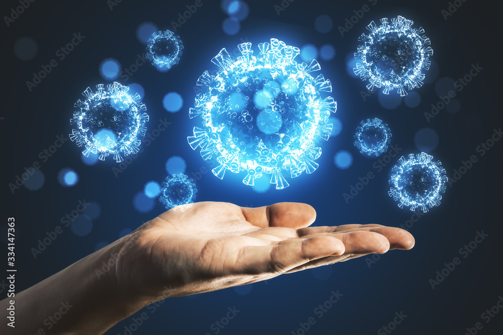 Hand holding blue virus cells. Hand holding blue virus cells.