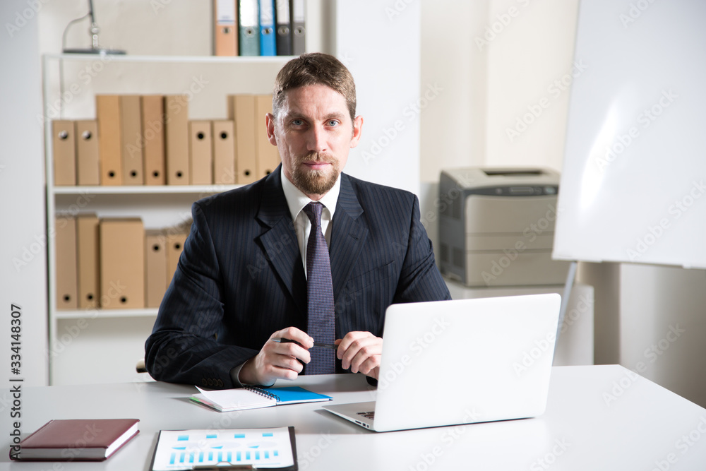 Young handsome businessman in a modern office Young handsome businessman in a modern office