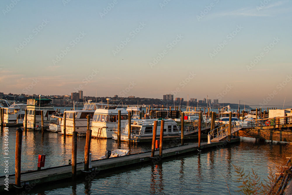 recreational port in river at sunset with old boats