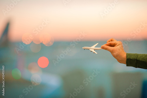 Close up hand holding an airplane model photo