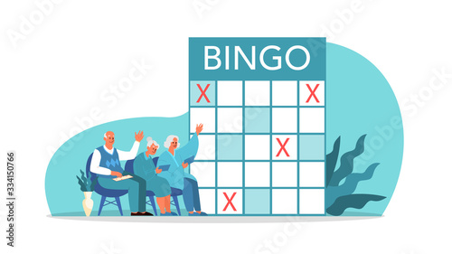 Happy elderly playing bingo together. Old man and woman playing