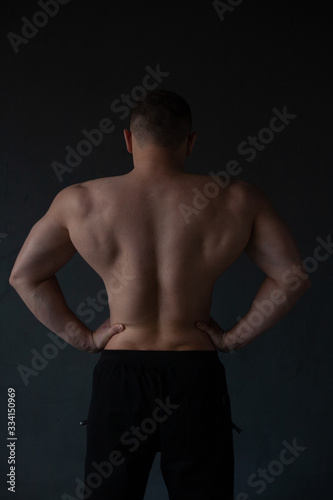 athletic guy strains his back © Артем Коноплянко
