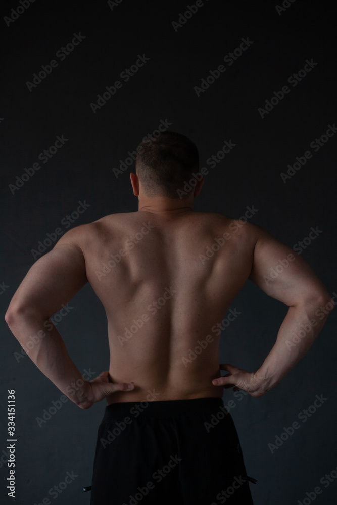 athletic guy strains his back