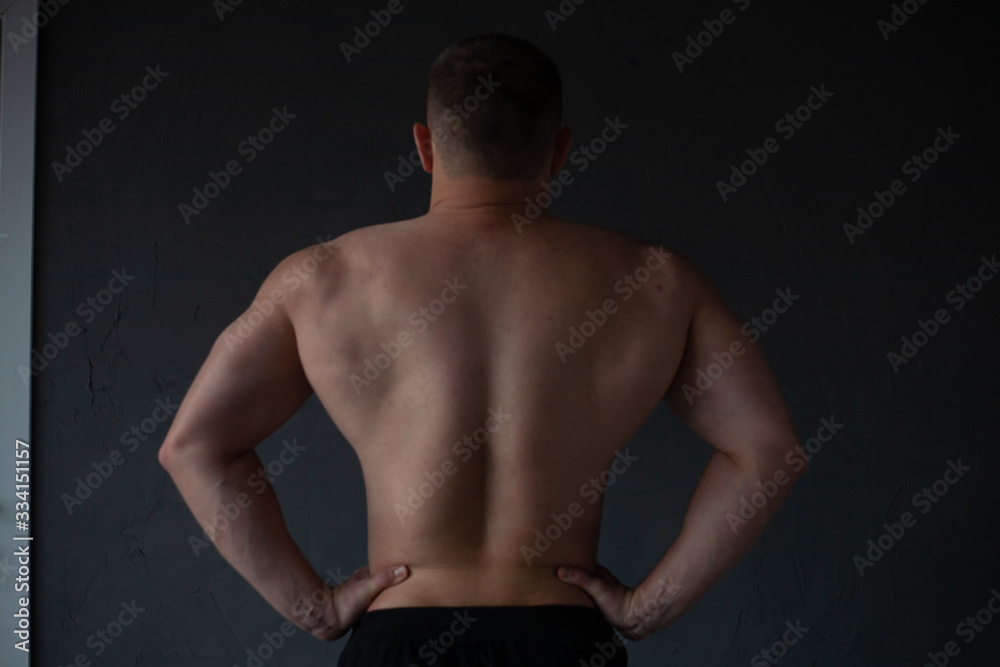 athletic guy strains his back