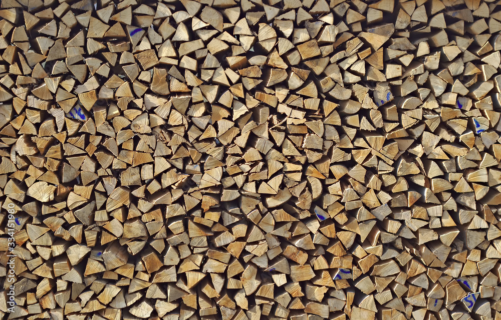 Wood, chopped and stacked. Background with structure.
