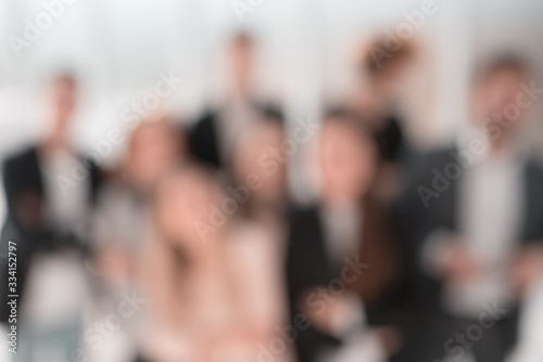 blurry image of a group of young business people