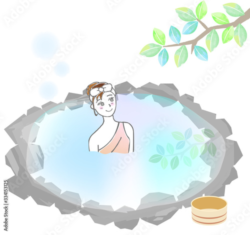 湯あみ着で露天風呂に入る女性