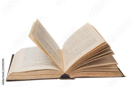 Open old book with blurred out words, isolated background