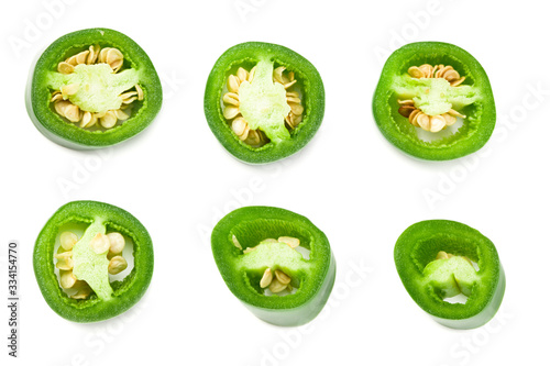 sliced jalapeno peppers isolated on white background. Green chili pepper. Capsicum annuum. top view