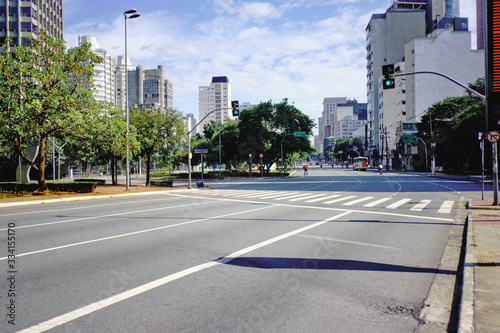 Images of São Paulo city under the Covid-19 quarantine ( March 2020 ) with empty streets, closed commerce and no cars. Some people still on the street, walking or cycling.