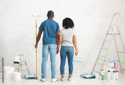 African american couple with paint and instruments, planning home repair © Prostock-studio