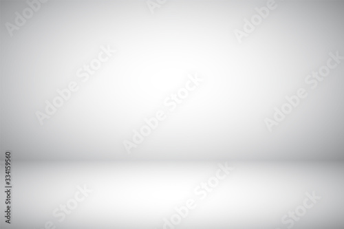 Empty gray studio abstract background with spotlight effect. Product showcase backdrop.
