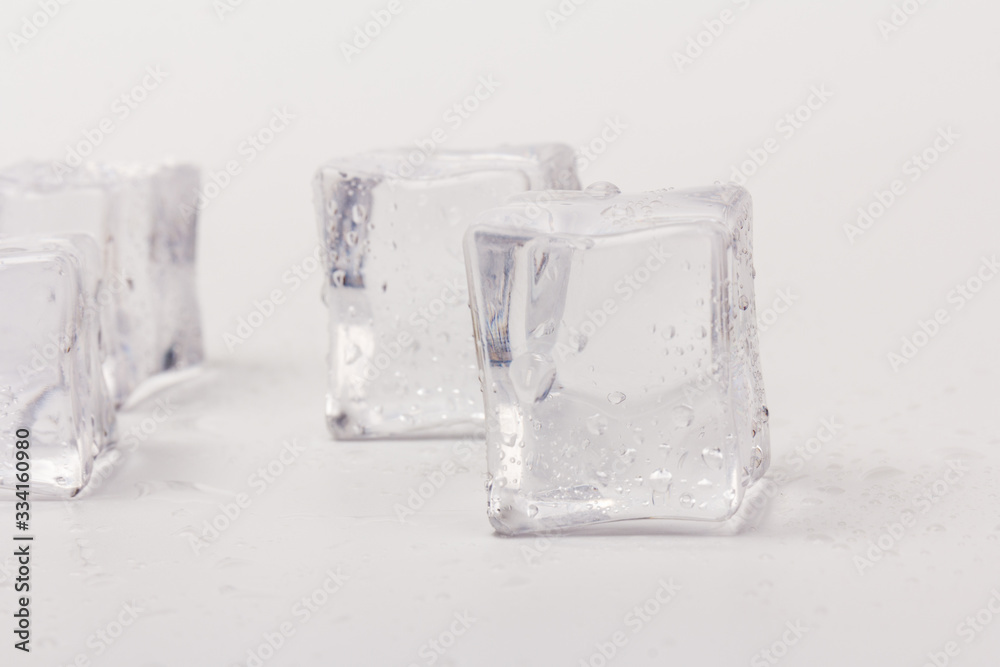 ice cubes in close-up on gray background ice cubes in close-up on gray background