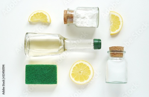 Creative flat lay composition with ecological, natural, non toxic home cleaning products, vinegar, salt, soda, lemon.