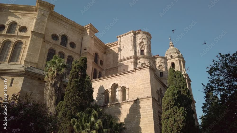 The Cathedral of Malaga with pigeons flying. Renaissance church in Malaga. Costa del Sol, Andalusia, Spain. The Cathedral of Malaga with pigeons flying. Renaissance church in Malaga. Costa del Sol, Andalusia, Spain.