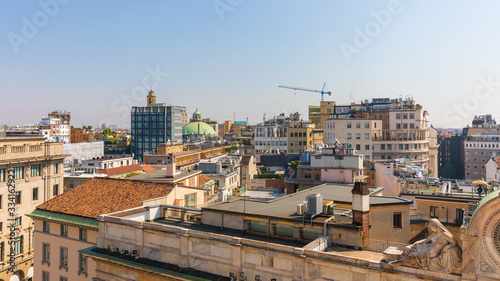 View on roofs with a top of dome of the Basilica San Carlo al Corso of Milan