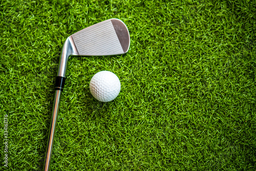 Playing golf on the green grass.