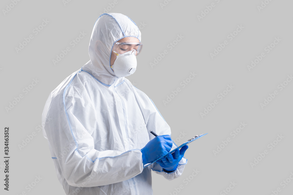 Human epidemic danger. Asian male doctor writes information Human epidemic danger. Asian male doctor writes information