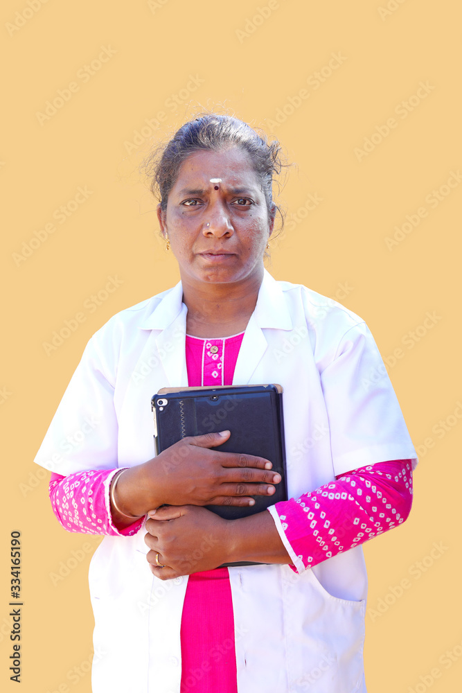 Female South Asian doctor holding a digital tablet. Female South Asian doctor holding a digital tablet.