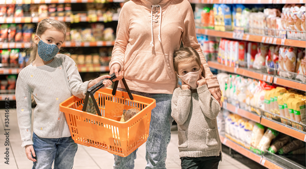 Mom and kids are shopping at the grocery store.