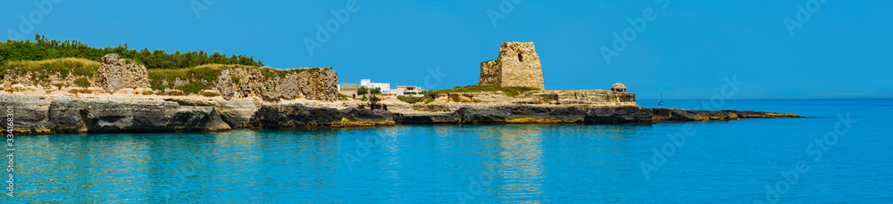 Holiday in Apulia. The important archaeological site and tourist resort of Roca Vecchia, in Puglia, Salento, Italy. In the background, an anti-aircraft casemate from World War II