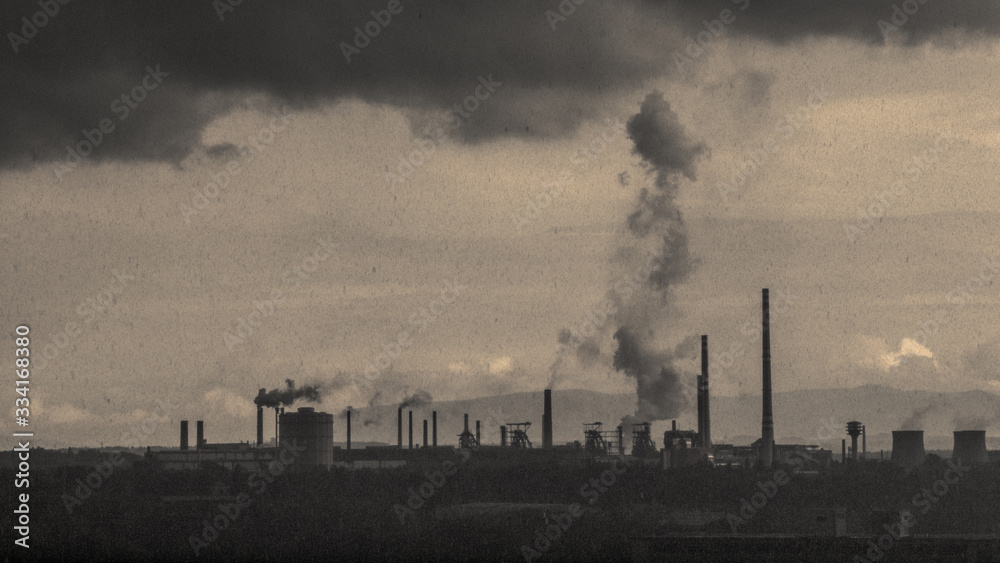 Polluted industrial area. Silhouettes of factories with smoking chimneys. Dark grunge mood - obrazy, fototapety, plakaty 