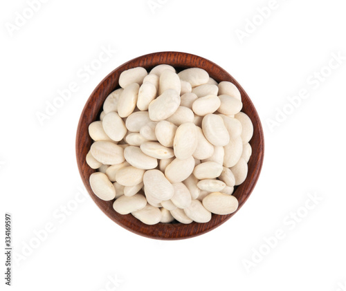 White kidney beans in wooden plate isolated on white background