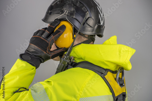 Man in personal protective equipment against falling from a height