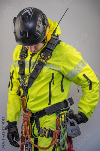 Man in personal protective equipment against falling from a height