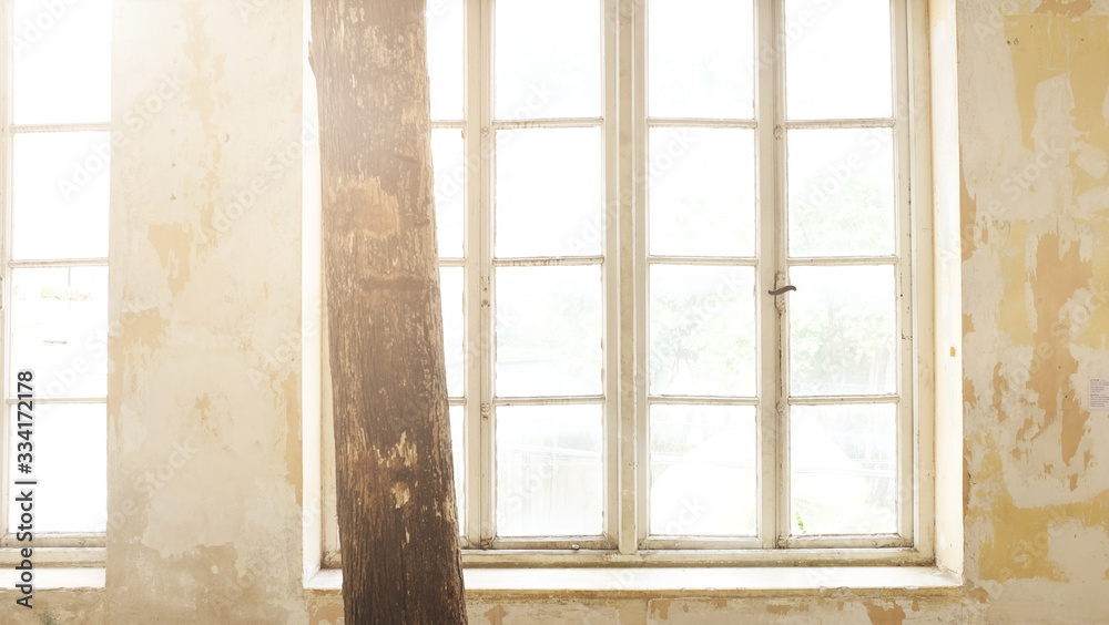 Fototapeta premium Industrial vintage interior with bright light coming through windows. - Image