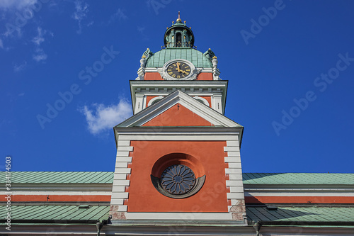 Red Saint James Church (Jakobs kyrka, from 1580) in Stockholm borough of Norrmalm. Saint James Church dedicated to Apostle Saint James the Greater, patron saint of travelers. Stockholm, Sweden. photo