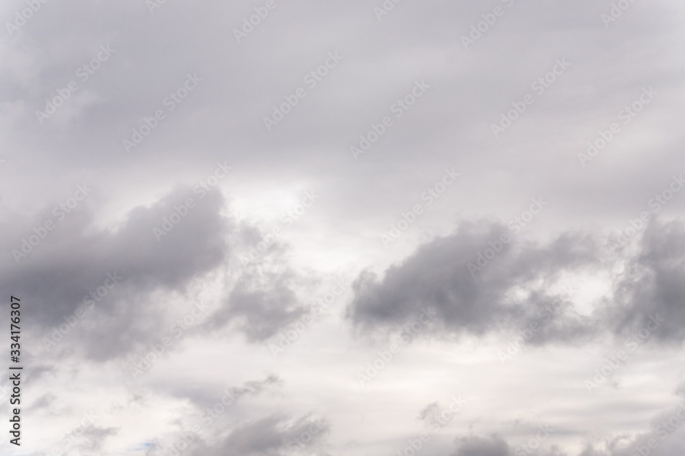 Obraz premium Dramatic gray clouds in the sky. Beautiful gray and white cloudy sky