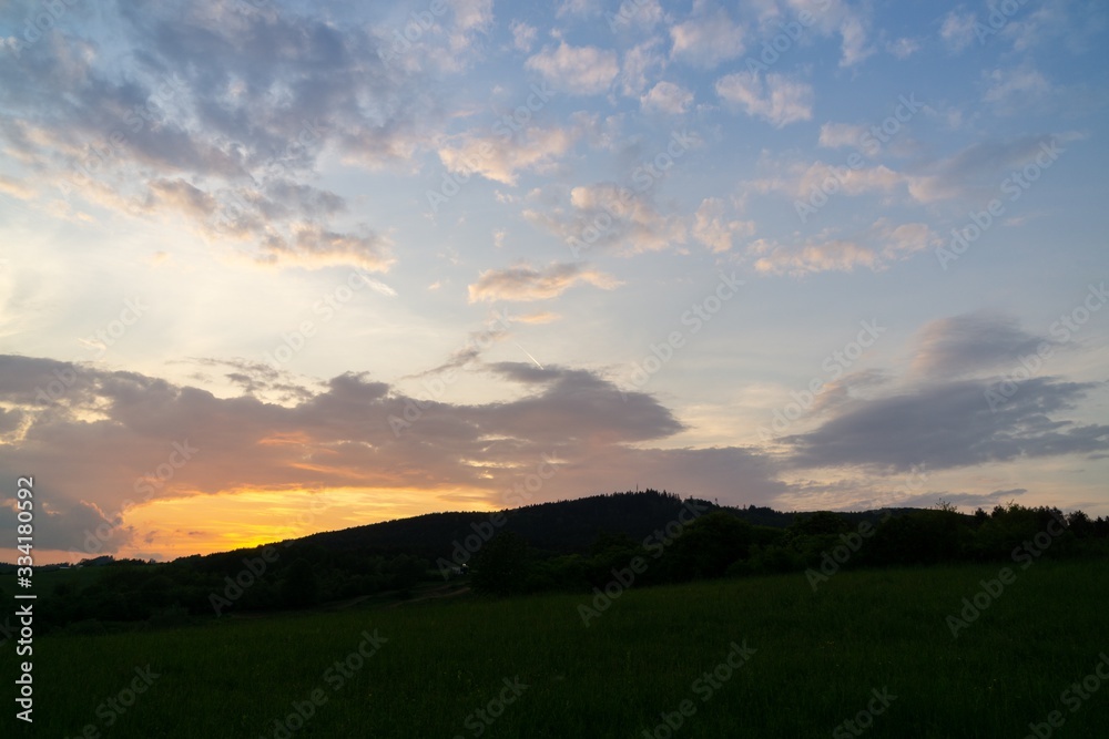 Obraz premium Sunrise or sunset over the hills and meadow. Slovakia