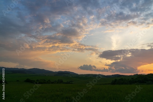 Sunrise or sunset over the hills and meadow. Slovakia