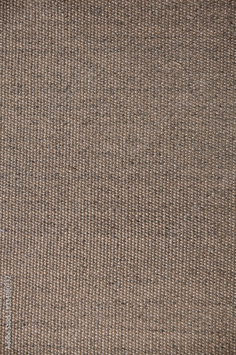 The surface texture of a natural Mat (straw, rope, or other natural material).