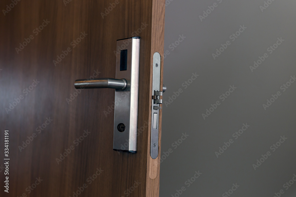 Fototapeta premium Wooden door with electronic lock. Close up view. 