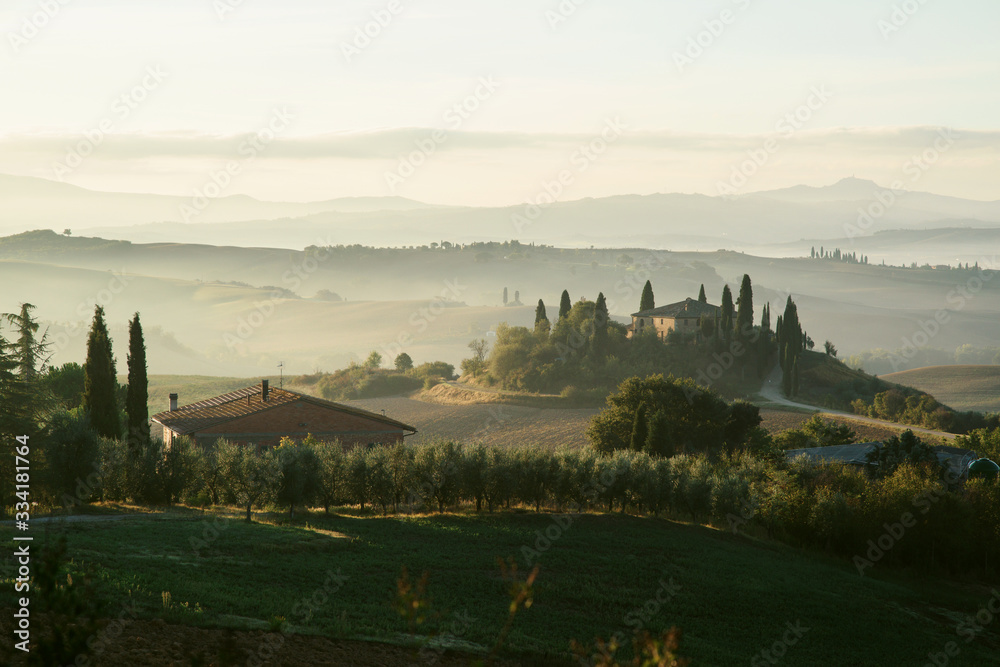 Tuscany. Villa Belvedere at early foggy morning in Val d'Orcia, Italy