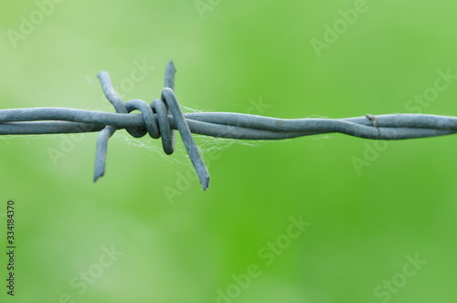 restricted access to field with barbed wire