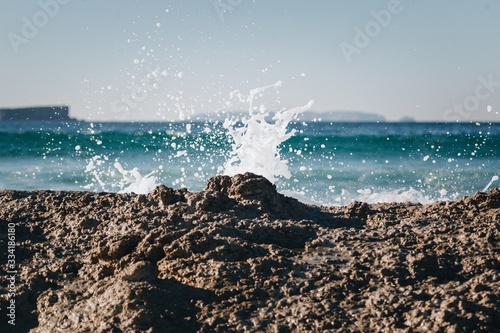 Wave splashing over rocks in Baleal photo