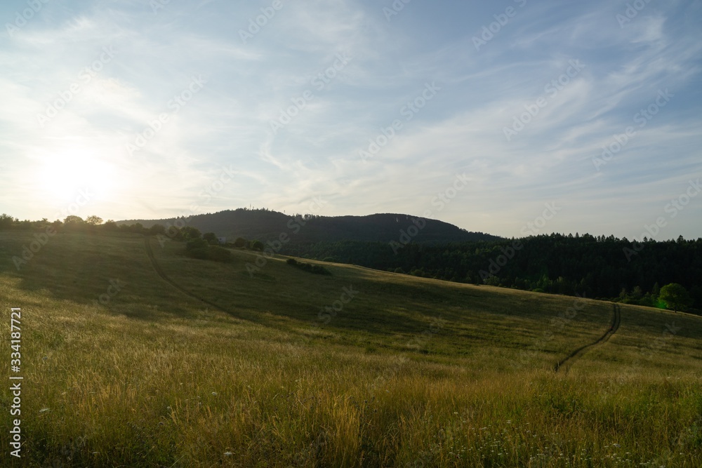 Obraz premium Sunrise or sunset over the hills and meadow. Slovakia