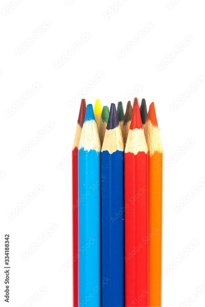 many colorful wooden crayons isolated on the white background many colorful wooden crayons isolated on the white background