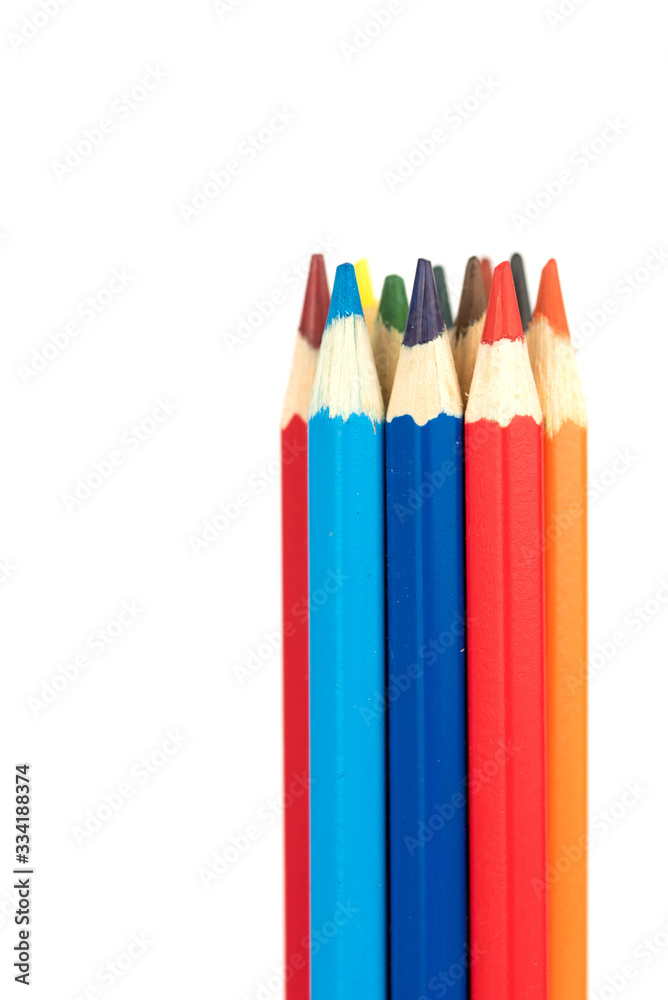 many colorful wooden crayons isolated on the white background many colorful wooden crayons isolated on the white background