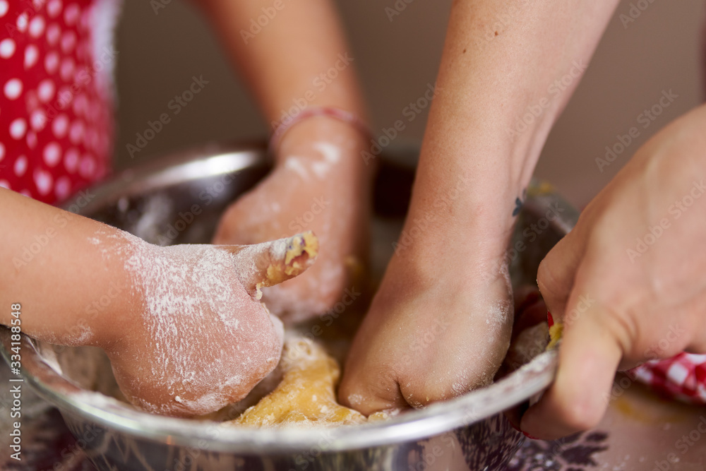 Young girl and her mom cooking Young girl and her mom cooking