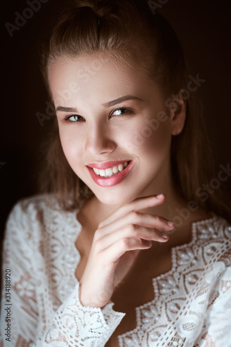 portrait of Stunning young fashionable bride holding bouquet