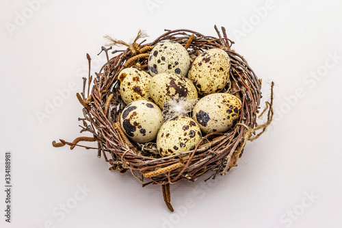 Easter bird nest with quail eggs isolated on white background. Zero waste, DIY concept