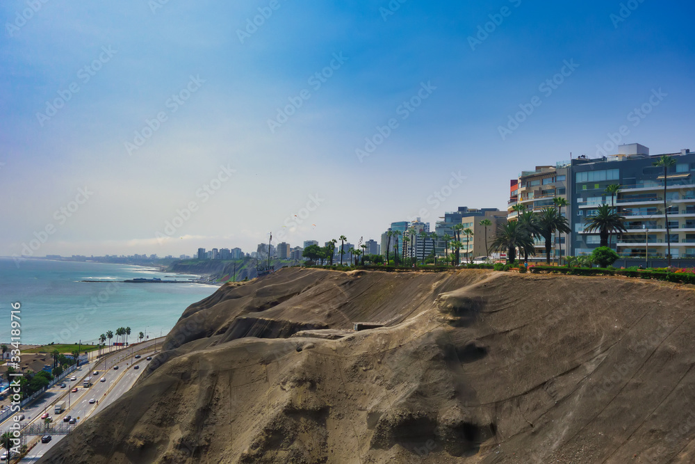 A strip of desert land between the city of Lima and the peaceful oceanic thing A strip of desert land between the city of Lima and the peaceful oceanic thing