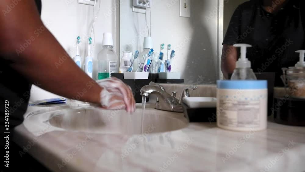 Black woman washing hands Black woman washing hands