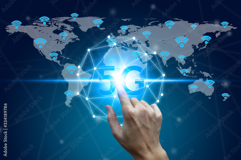 World map with 5G wifi technology background, hand touch network using 5G technology with virtual screen icons on a black background, Technology Internet 5G global network concept. World map with 5G wifi technology background, hand touch network using 5G technology with virtual screen icons on a black background, Technology Internet 5G global network concept.