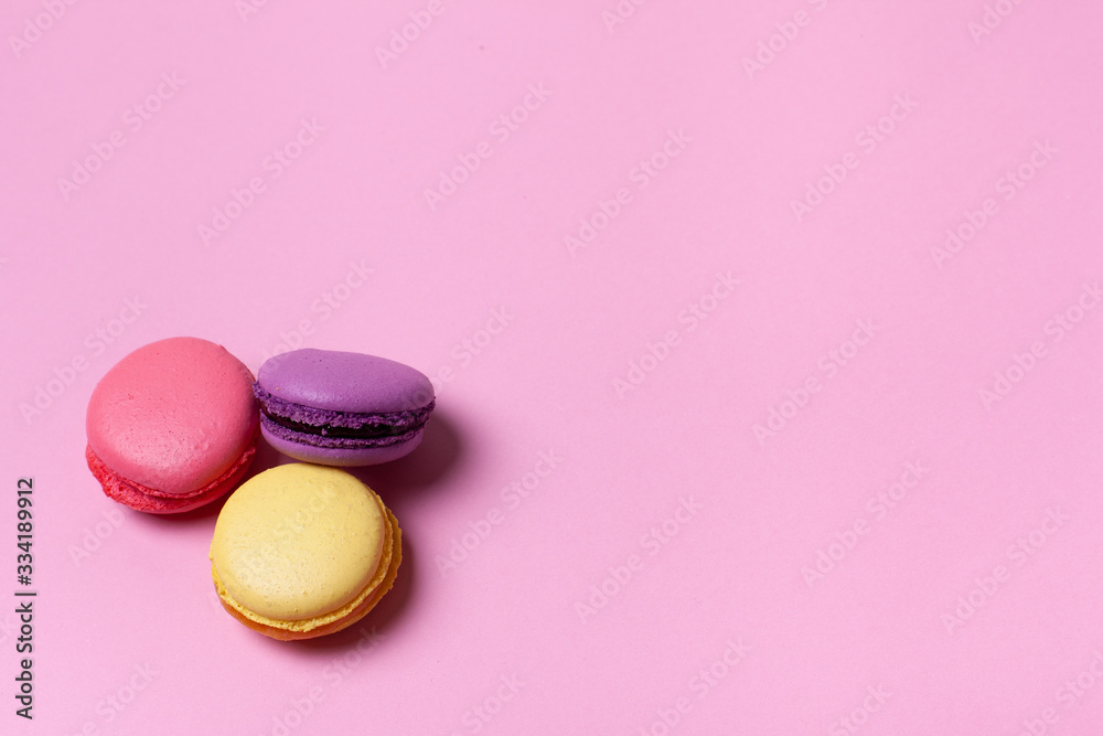 Fresh tasty macaron cake or macaroon on pink pastel background top view. Fresh tasty macaron cake or macaroon on pink pastel background top view.