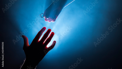 Photos The hand on top holds the key to the man
